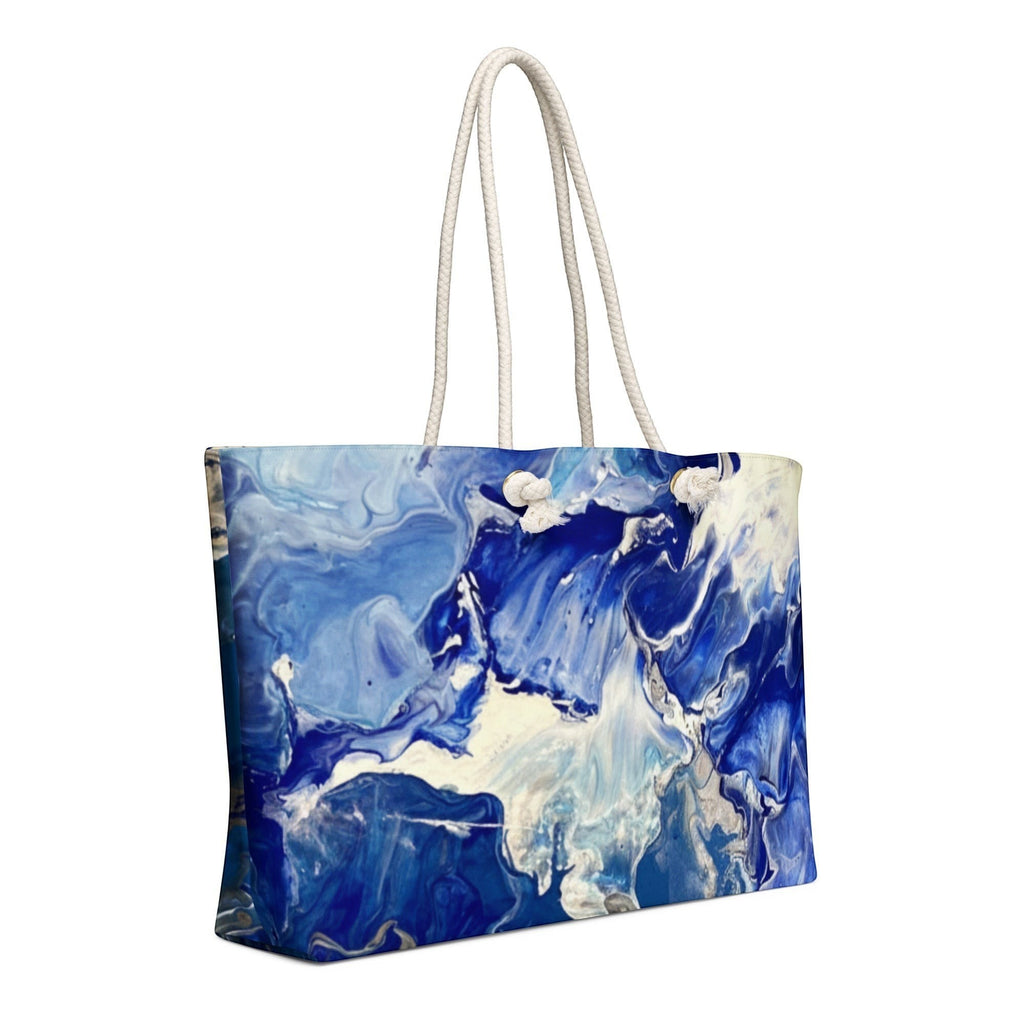 My Store weekender bag with abstract blue and white fluid art print, cream rope handles.